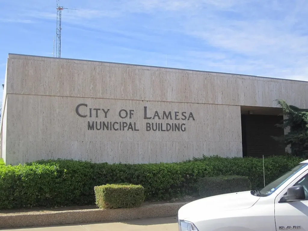 The exterior of the City of Lamesa Municipal Building under a blue sky, representing the local service coverage area for a commercial and residential plumber Lamesa, TX.