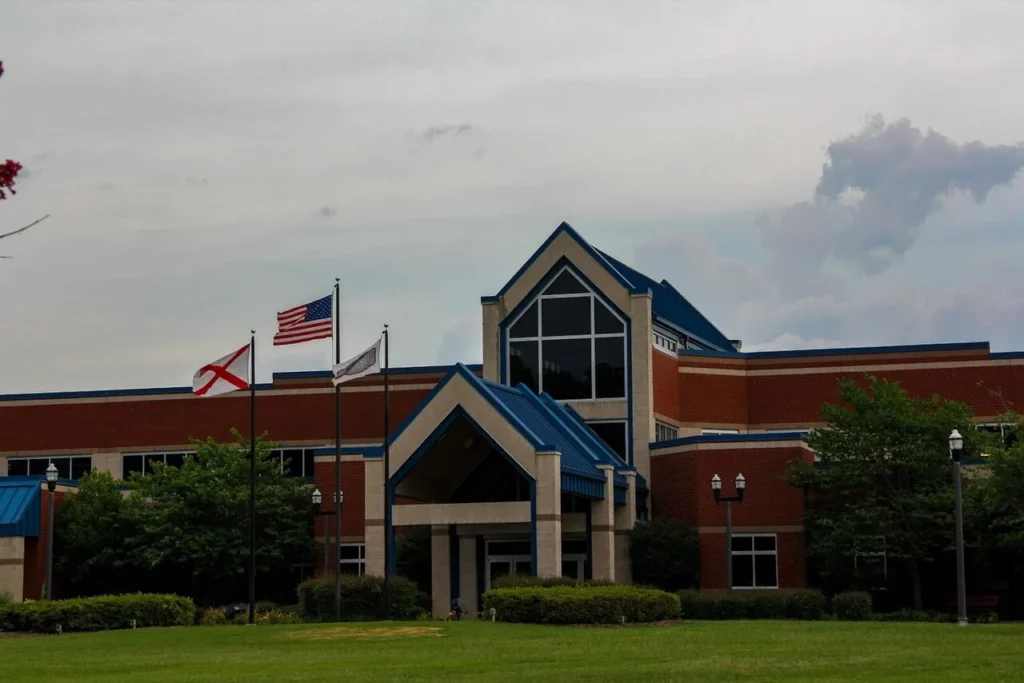 Exterior view of a large brick civic building requiring routine commercial maintenance from an expert plumber Gardendale TX to handle complex facility water lines and drainage systems.