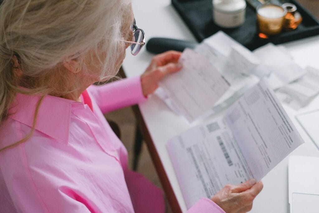 Home Owner Reviewing Why Is My Water Bill Suddenly High? a high water bill for unexpected charges.